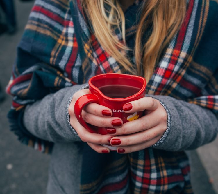 girl with cup of coffee in scarf