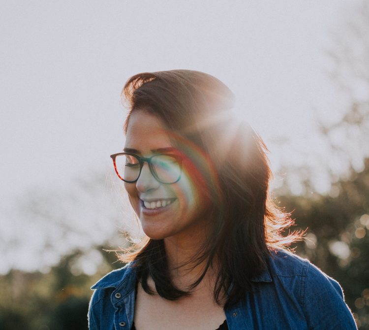 Women wearing glasses smiling in the sun