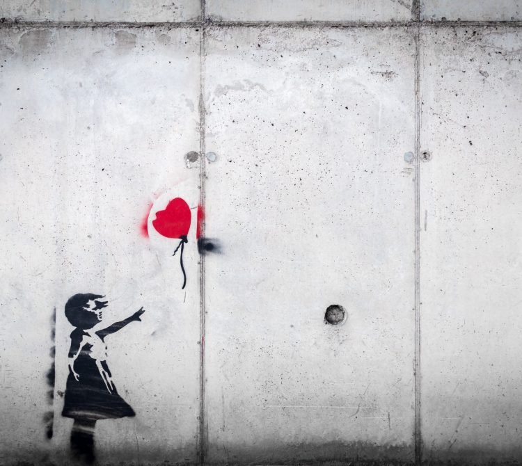 stencil art of girl with red balloon