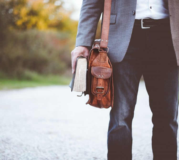 man with brief case in work clothes