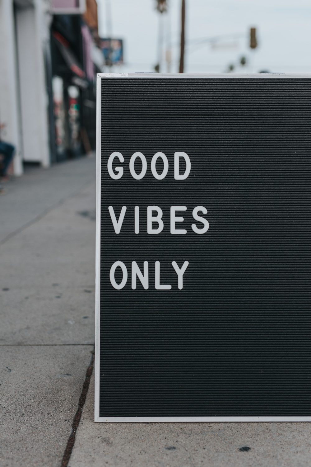 Sign outside a cafe reading Good Vibes Only