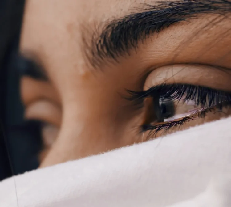 Close up of a person's eyes with tears