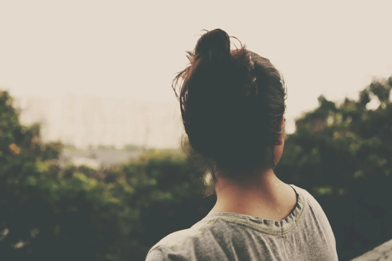 A woman looking away from the camera into the distance