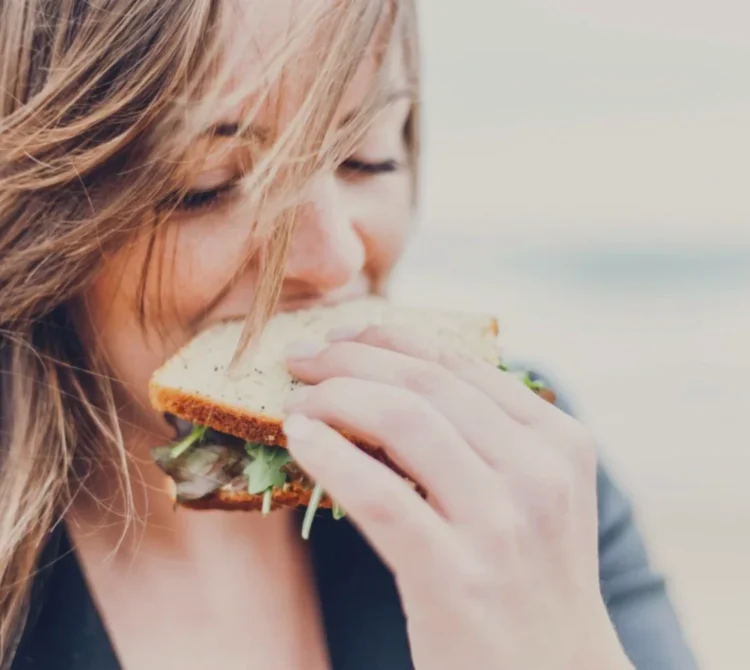 A woman eating a sandwich