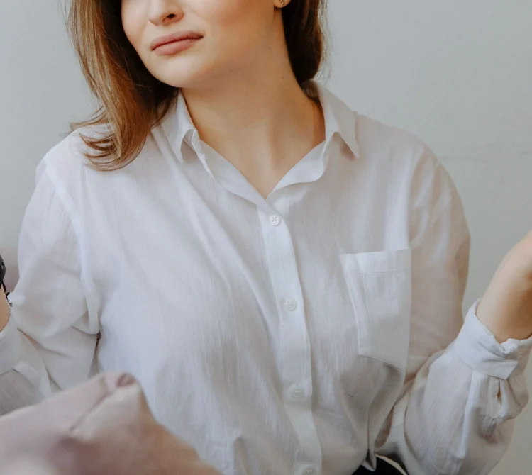 person holding two hands up and shrugging.